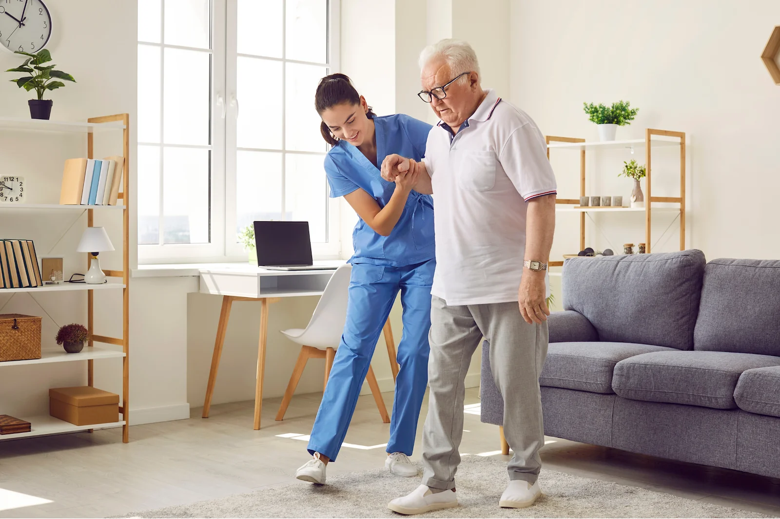 Physical therapist helping senior man with balance and mobility exercises