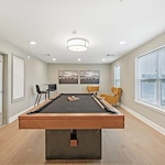 Willow Manor at Cabin Branch senior living community offering independent living and affordable living in Clarksburg, MD, activities room with a pool table