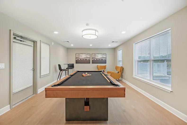 Willow Manor at Cabin Branch senior living community offering independent living and affordable living in Clarksburg, MD, activities room with a pool table