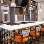 Watermere at the Preserve senior living community offering active adult living and independent living in North Richland Hills, TX, community bar with bar stool seating at the countertop