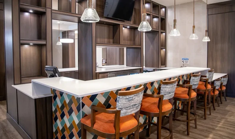 Watermere at the Preserve senior living community offering active adult living and independent living in North Richland Hills, TX, community bar with bar stool seating at the countertop