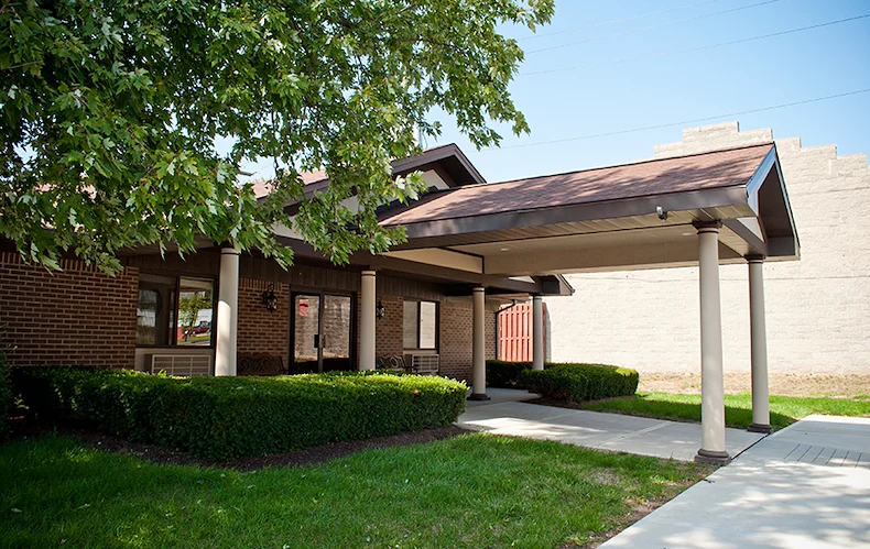 Bethany Village Assisted Senior Living and Respite Care in Indianapolis, IN front entrance exterior with landscaping