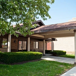 Bethany Village Assisted Senior Living and Respite Care in Indianapolis, IN front entrance exterior with landscaping