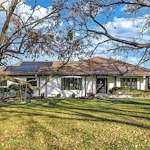 Legato Living Residential Memory Care at Indian Hills senior living community offering assisted living and memory care in Omaha, NE, exterior view of the home with front yard landscaping