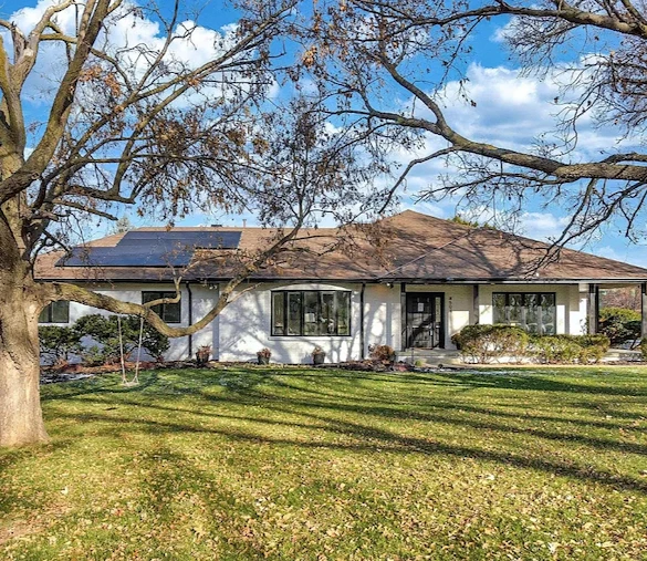 Legato Living Residential Memory Care at Indian Hills senior living community offering assisted living and memory care in Omaha, NE, exterior view of the home with front yard landscaping