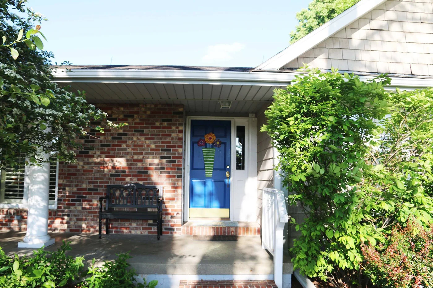 Legato Living Residential Memory Care at Legacy senior living community offering assisted living, memory care, adult day services, and respite care in Omaha, NE, entrance featuring a blue front door