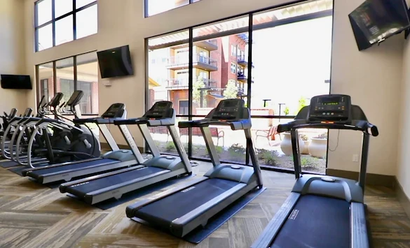 Watermere at Frisco senior living community offering active adult living and independent living in Frisco, TX, fitness center featuring treadmills and other equipment