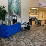 Avamere at South Hill senior living community offering assisted living and respite care in Spokane, WA, community lobby area with refreshment table featuring coffee and water setup 