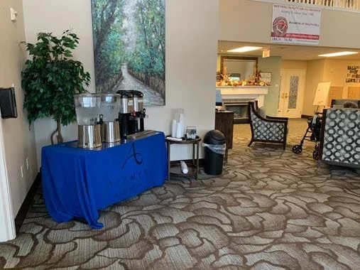 Avamere at South Hill senior living community offering assisted living and respite care in Spokane, WA, community lobby area with refreshment table featuring coffee and water setup 