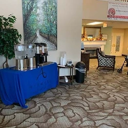 Avamere at South Hill senior living community offering assisted living and respite care in Spokane, WA, community lobby area with refreshment table featuring coffee and water setup