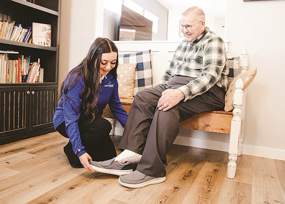 Assisting Hands Fremont, non-medical home care services in Newark, CA, serving Alameda County, caregiver providing help with dressing