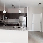 Banyan Reserve Seniors, senior living community offering active adult living and independent living in Lakeland, FL, apartment featuring a kitchen with stainless steel appliances