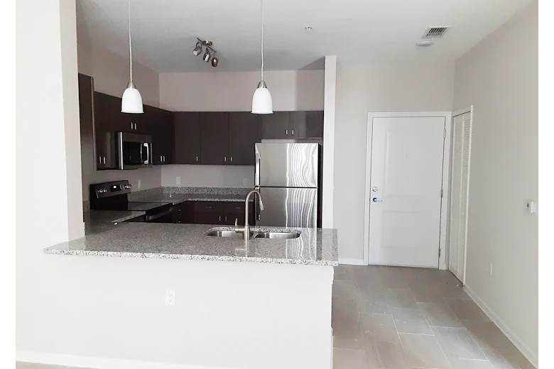 Banyan Reserve Seniors, senior living community offering active adult living and independent living in Lakeland, FL, apartment featuring a kitchen with stainless steel appliances