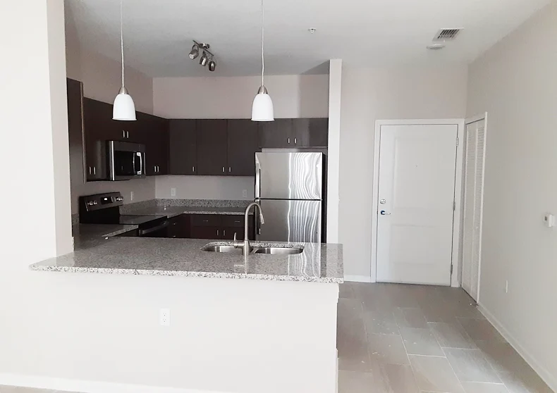 Banyan Reserve Seniors, senior living community offering active adult living and independent living in Lakeland, FL, apartment featuring a kitchen with stainless steel appliances