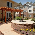 Whispering Pines Gracious Retirement Living Hawthorn Senior Independent Living in Raleigh, North Carolina rear exterior patio firepit gazebo