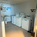 Sugar Creek Apartments independent senior living in Waukee, Iowa laundry room