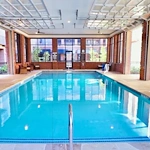 Watermere at Frisco senior living community offering active adult living and independent living in Frisco, TX, indoor pool with garage doors that open to the outdoors