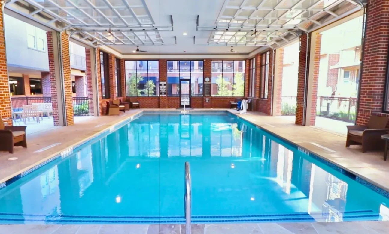 Watermere at Frisco senior living community offering active adult living and independent living in Frisco, TX, indoor pool with garage doors that open to the outdoors