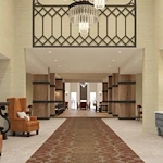 Watermere at Flower Mound senior living community offering active adult living and independent living in Flower Mound, TX, featuring a welcoming lobby with a front desk and orange chairs