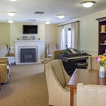 Charter Senior Living of Columbia common sitting area by fireplace