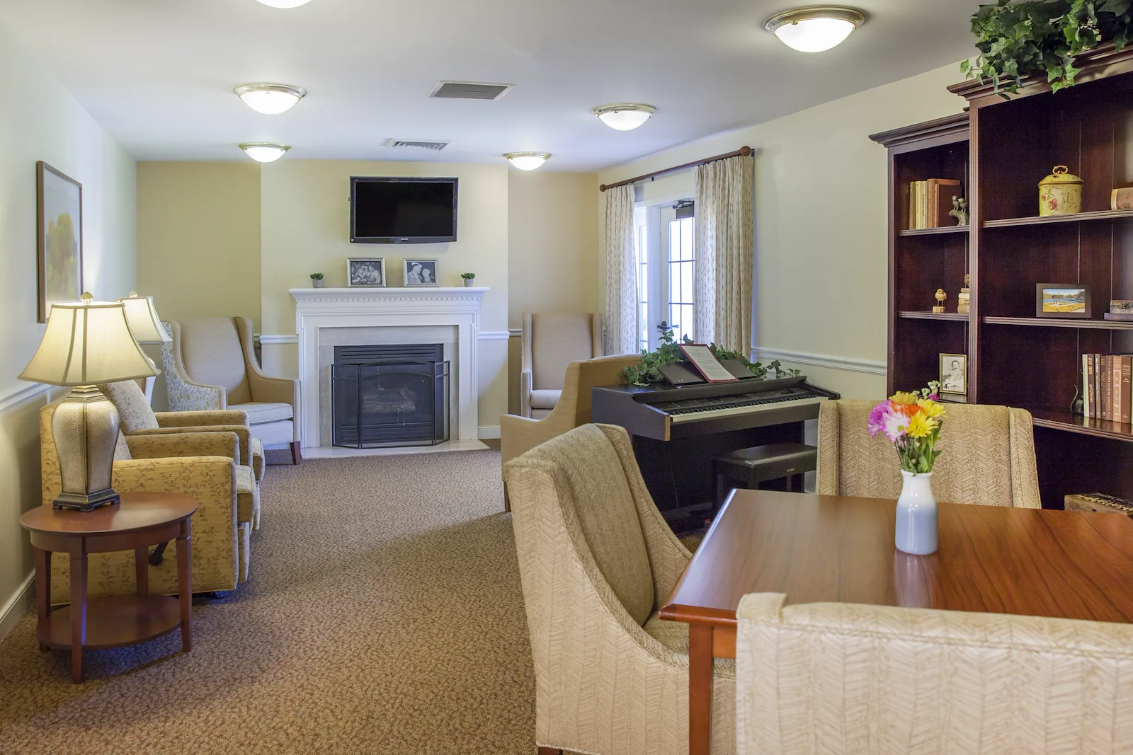 Charter Senior Living of Columbia common sitting area by fireplace