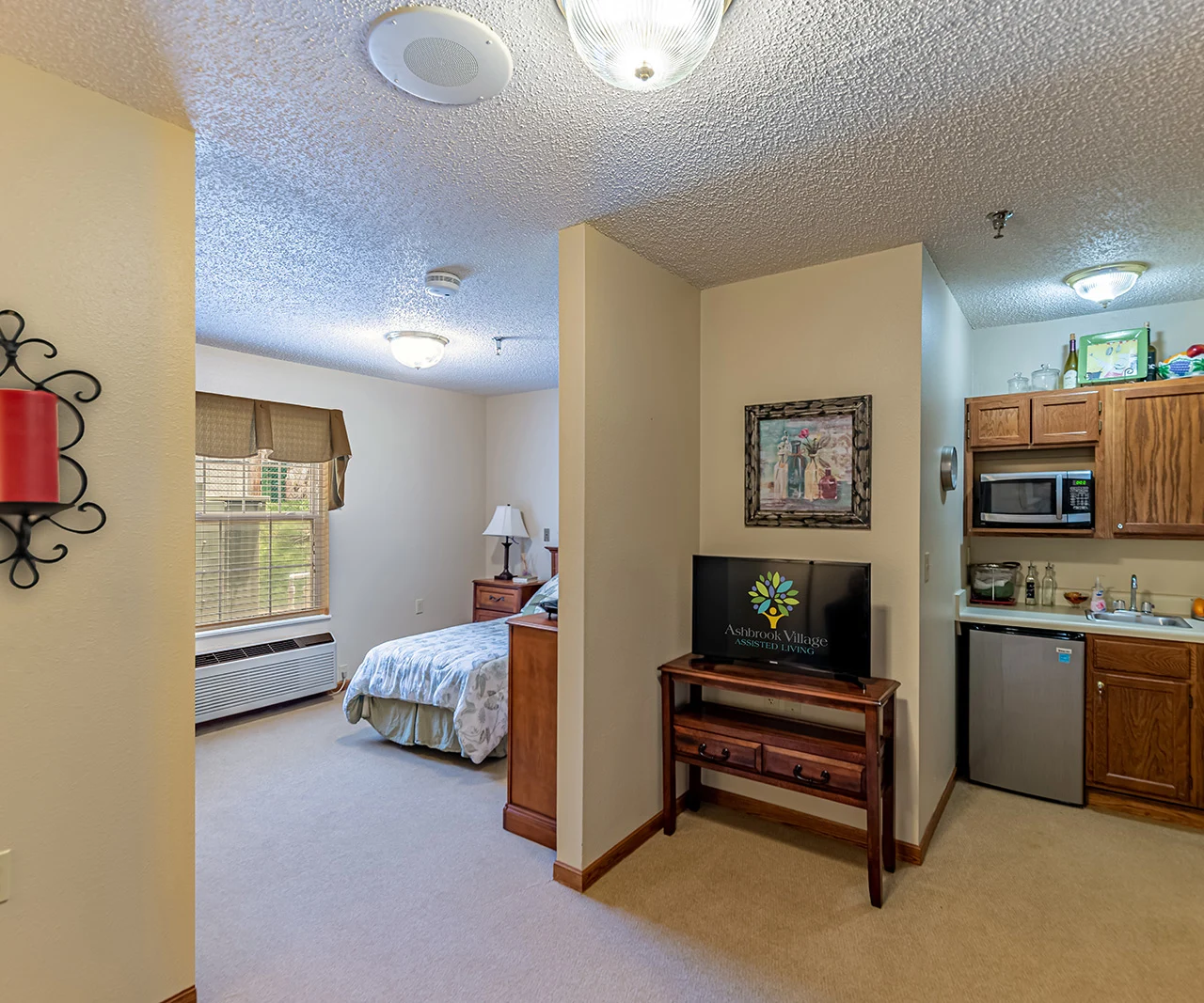 Ashbrook Village senior living community offering independent living, assisted living, and memory care in Duncan, OK, studio apartment featuring a bedroom and kitchenette