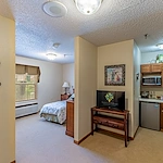 Ashbrook Village senior living community offering independent living, assisted living, and memory care in Duncan, OK, studio apartment featuring a bedroom and kitchenette
