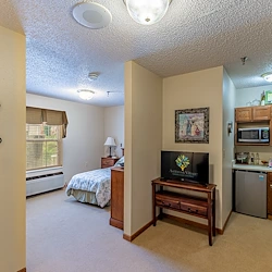 Ashbrook Village senior living community offering independent living, assisted living, and memory care in Duncan, OK, studio apartment featuring a bedroom and kitchenette
