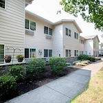 Albany Senior Living by Cogir, assisted living and respite care community in Albany, OR, exterior with exterior with landscaping and a walking path