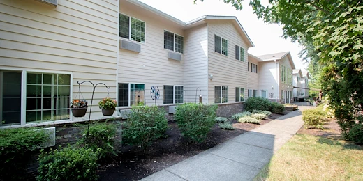 Albany Senior Living by Cogir, assisted living and respite care community in Albany, OR, exterior with exterior with landscaping and a walking path