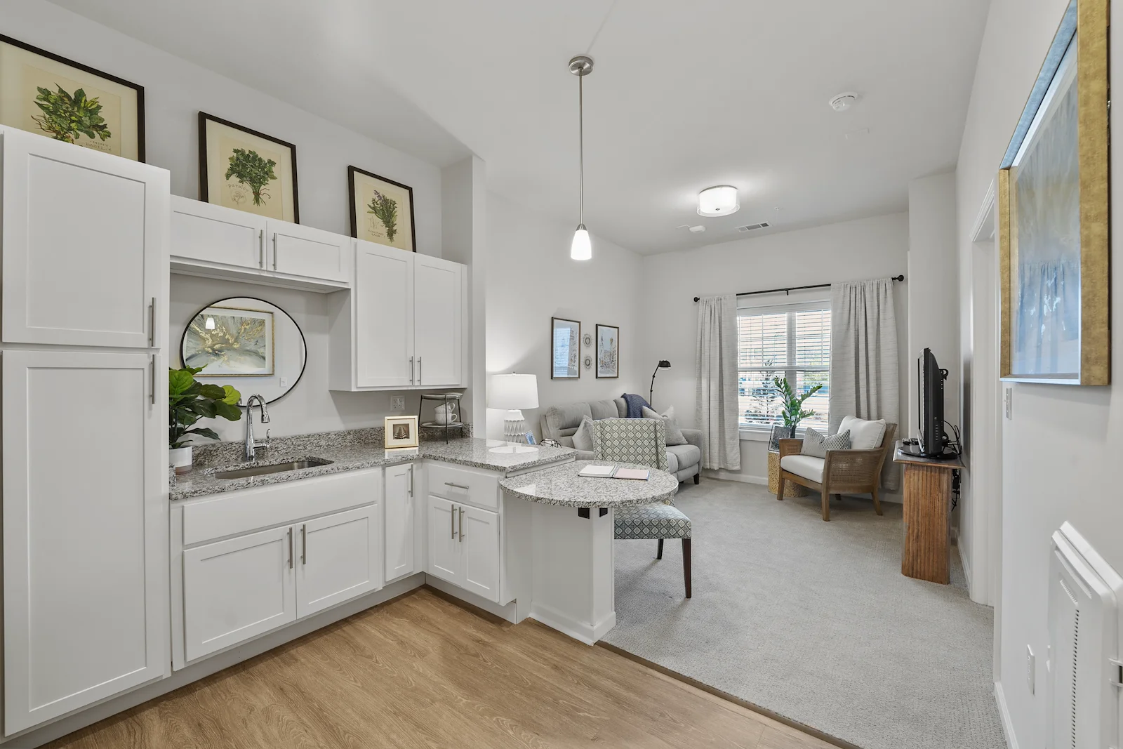 Alto Johns Creek, senior living community offering assisted living, memory care, and respite care in Duluth, GA, apartment featuring a kitchenette and comfortable living area