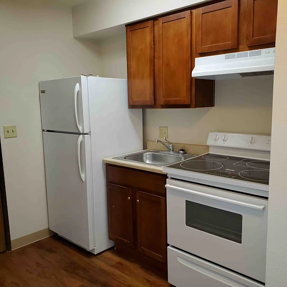 Full kitchen with refrigerator/freezer, oven and stove (no microwave)