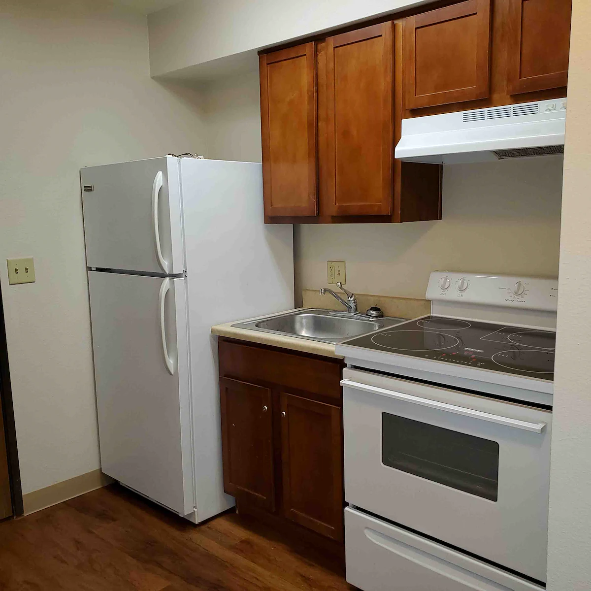 Full kitchen with refrigerator/freezer, oven and stove (no microwave)