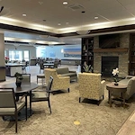 Fieldstone Memory Care of Silverdale sitting area by fireplace