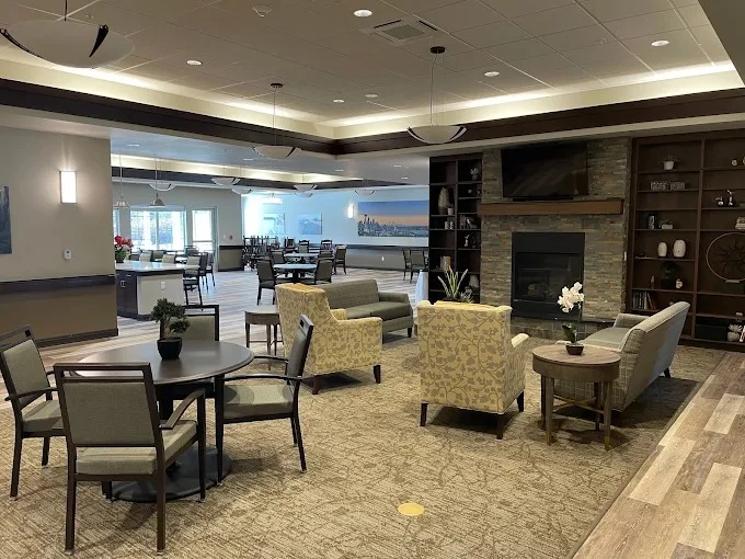 Fieldstone Memory Care of Silverdale sitting area by fireplace