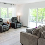 Legato Living Residential Memory Care at Heartland Hills senior living community offering assisted living, memory care, adult day services, and respite care in Bellevue, NE, community living room with comfortable furniture