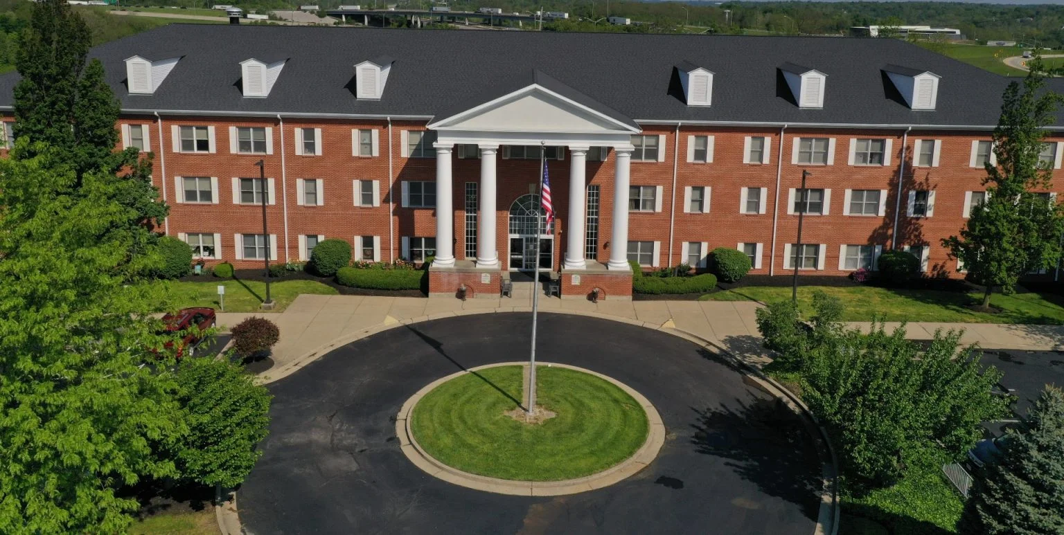 Long House senior living community offering independent living and respite care in Erlanger, KY, front exterior with brick facade
