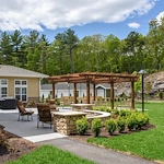 Ashton Gardens Gracious Retirement Living Hawthorn Senior Living Community in Portland, Maine exterior patio seating area