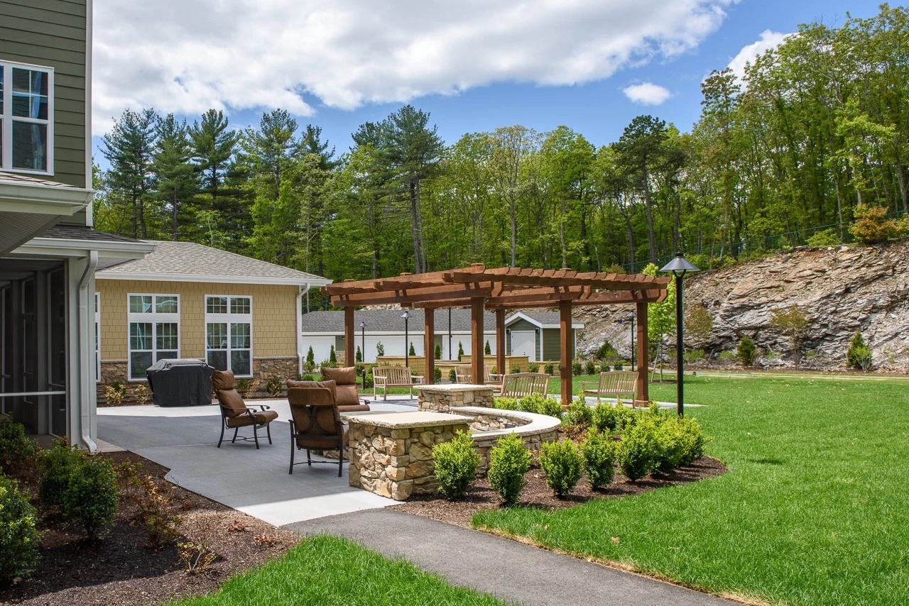 Ashton Gardens Gracious Retirement Living Hawthorn Senior Living Community in Portland, Maine exterior patio seating area