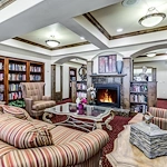 Alexis Estates Gracious Retirement Living by Hawthorn Senior Living, independent living in Allen, TX, sitting area by fireplace for socializing or reading