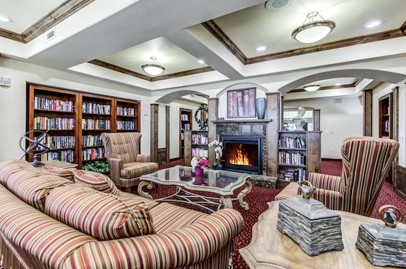 Alexis Estates Gracious Retirement Living by Hawthorn Senior Living, independent living in Allen, TX, sitting area by fireplace for socializing or reading