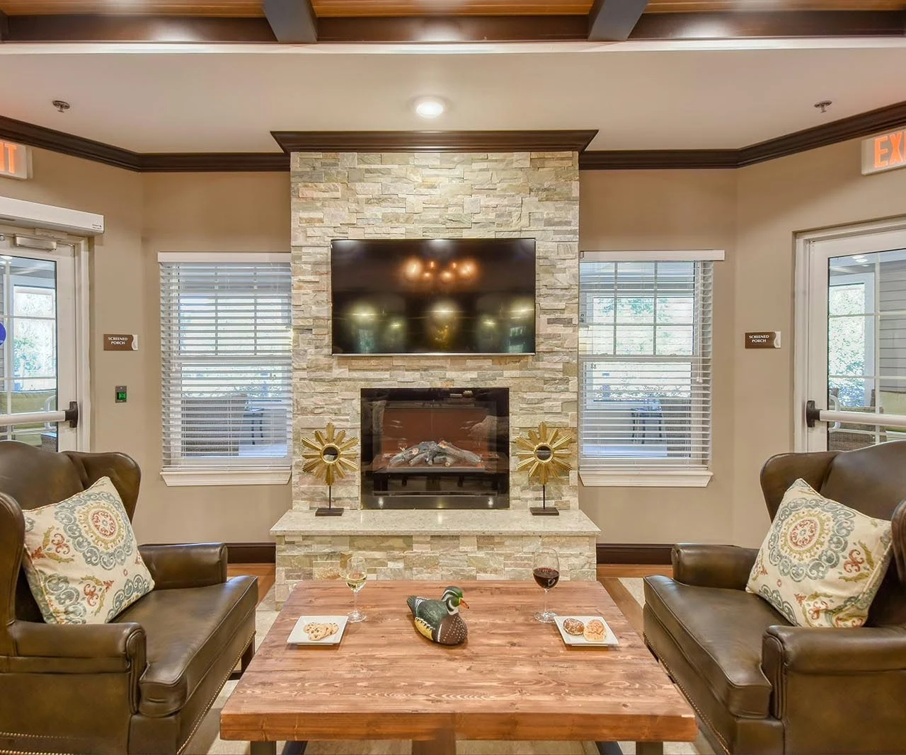 Anthem Lakes, senior living community offering independent living, assisted living, and memory care in Jacksonville, FL, sitting area by fireplace