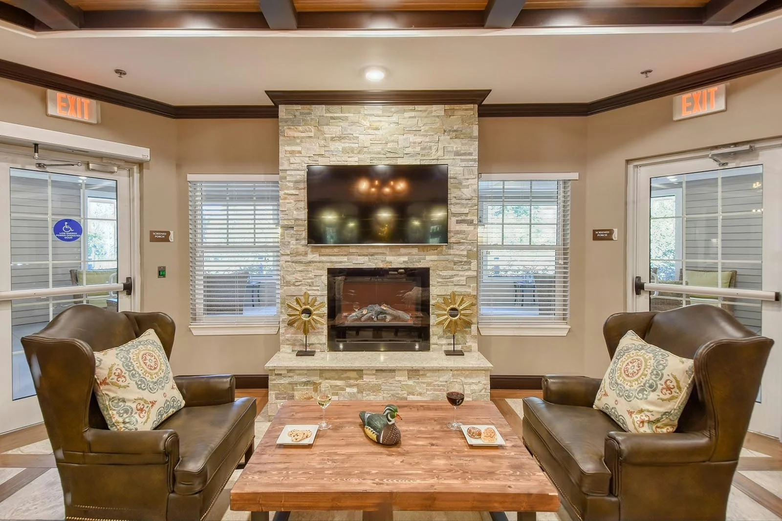 Anthem Lakes, senior living community offering independent living, assisted living, and memory care in Jacksonville, FL, sitting area by fireplace