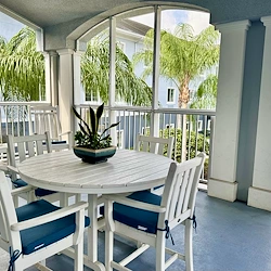 Alto Stuart, senior living community offering assisted living, memory care, and respite care in Stuart, FL, outdoor seating on a covered balcony