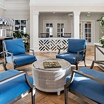 Westhill Newnan Crossing senior living community offering assisted living and memory care in Newnan, GA, indoor lounge area with the feel of an outdoor patio