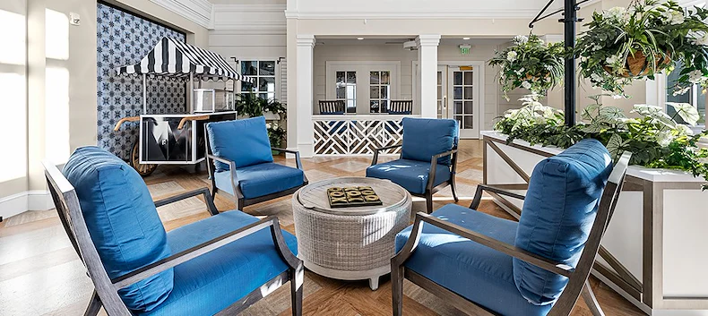 Westhill Newnan Crossing senior living community offering assisted living and memory care in Newnan, GA, indoor lounge area with the feel of an outdoor patio