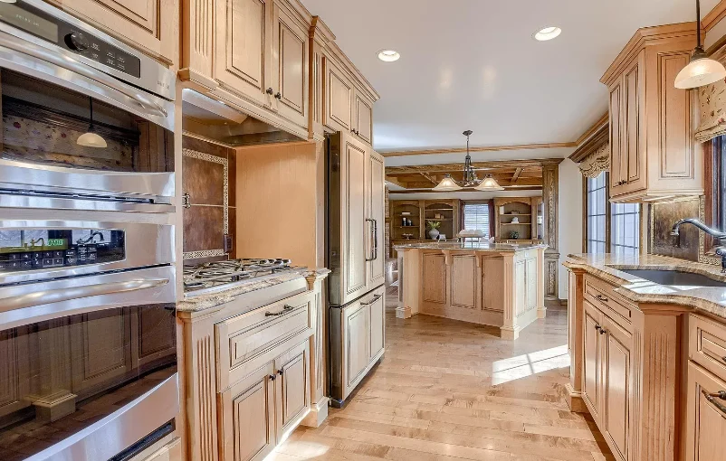 Legato Living Residential Memory Care at Rockbrook senior living community offering assisted living and memory care in Omaha, NE, kitchen with wooden cabinets and stainless steel appliances