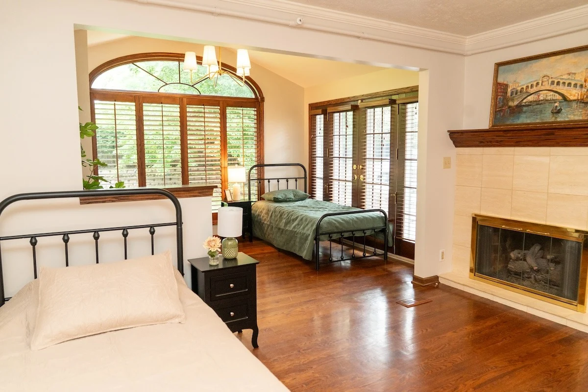 Legato Living Residential Memory Care at Rockbrook senior living community offering assisted living and memory care in Omaha, NE, shared suite featuring two beds and two nightstands