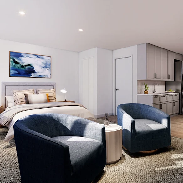 Allendale Senior Living, senior living community offering assisted living, memory care, and respite care in Allendale, NJ, studio apartment featuring a bed, sitting area, and kitchenette