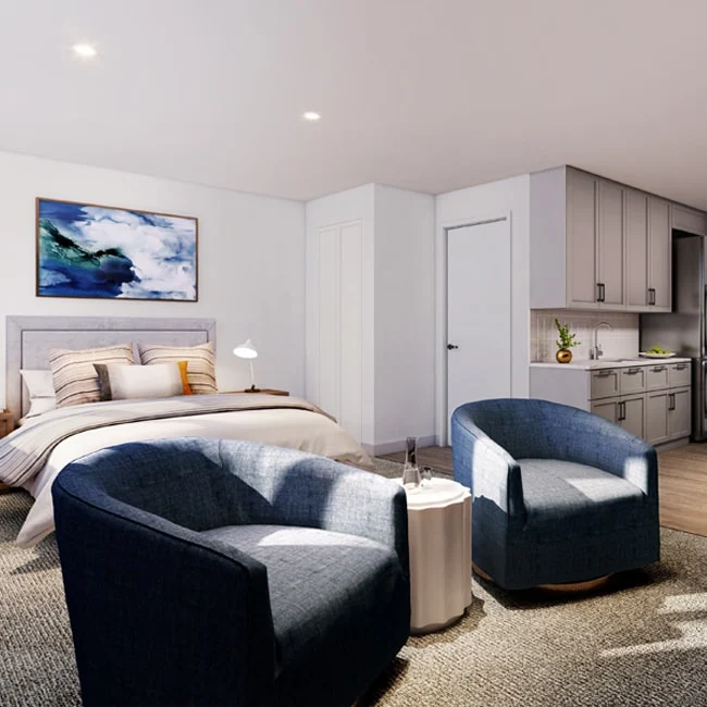 Allendale Senior Living, senior living community offering assisted living, memory care, and respite care in Allendale, NJ, studio apartment featuring a bed, sitting area, and kitchenette